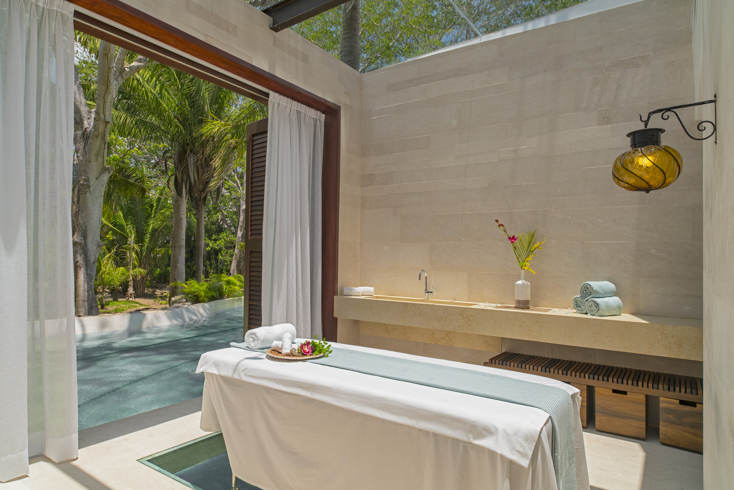 Detox and recharge at AWAY® Spa, either in a private indoor treatment room overlooking the lake or outside amid lush surroundings.